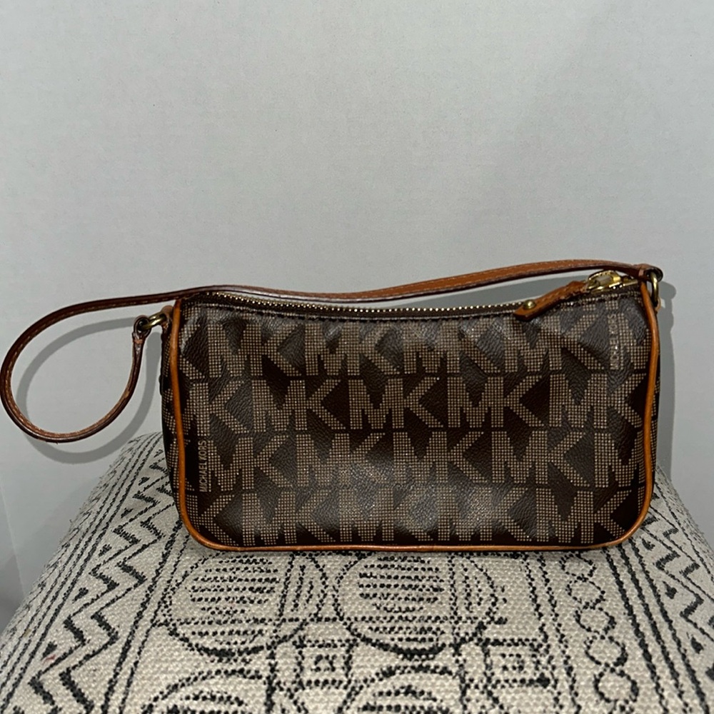 Authentic Michael Kors mini bag with strap.